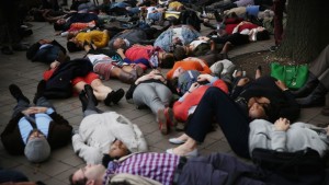 Activists participate in a "die-in" outside the Justice Department during a rally on Dec. 1 in Washington in response to a grand jury's decision not to indict Officer Darren Wilson in the fatal shooting of Michael Brown in Ferguson, Mo